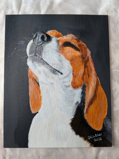 Serene Beagle is a beagle with eyes closed looking upwards on a black background